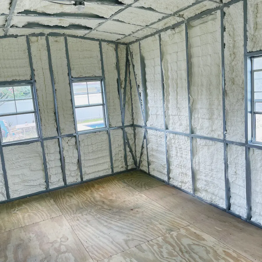 Closed-cell spray foam insulation applied to wall cavities in a residential project in Oak Point